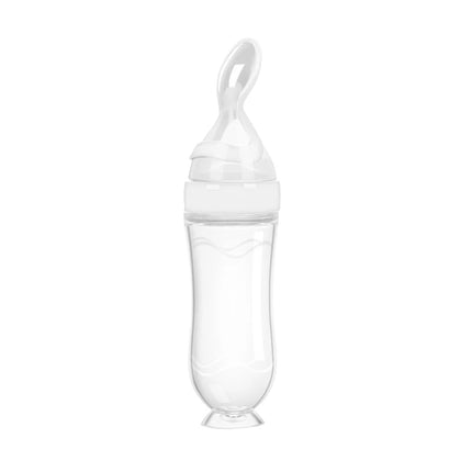 Clear baby bottle with a white cap on a white background